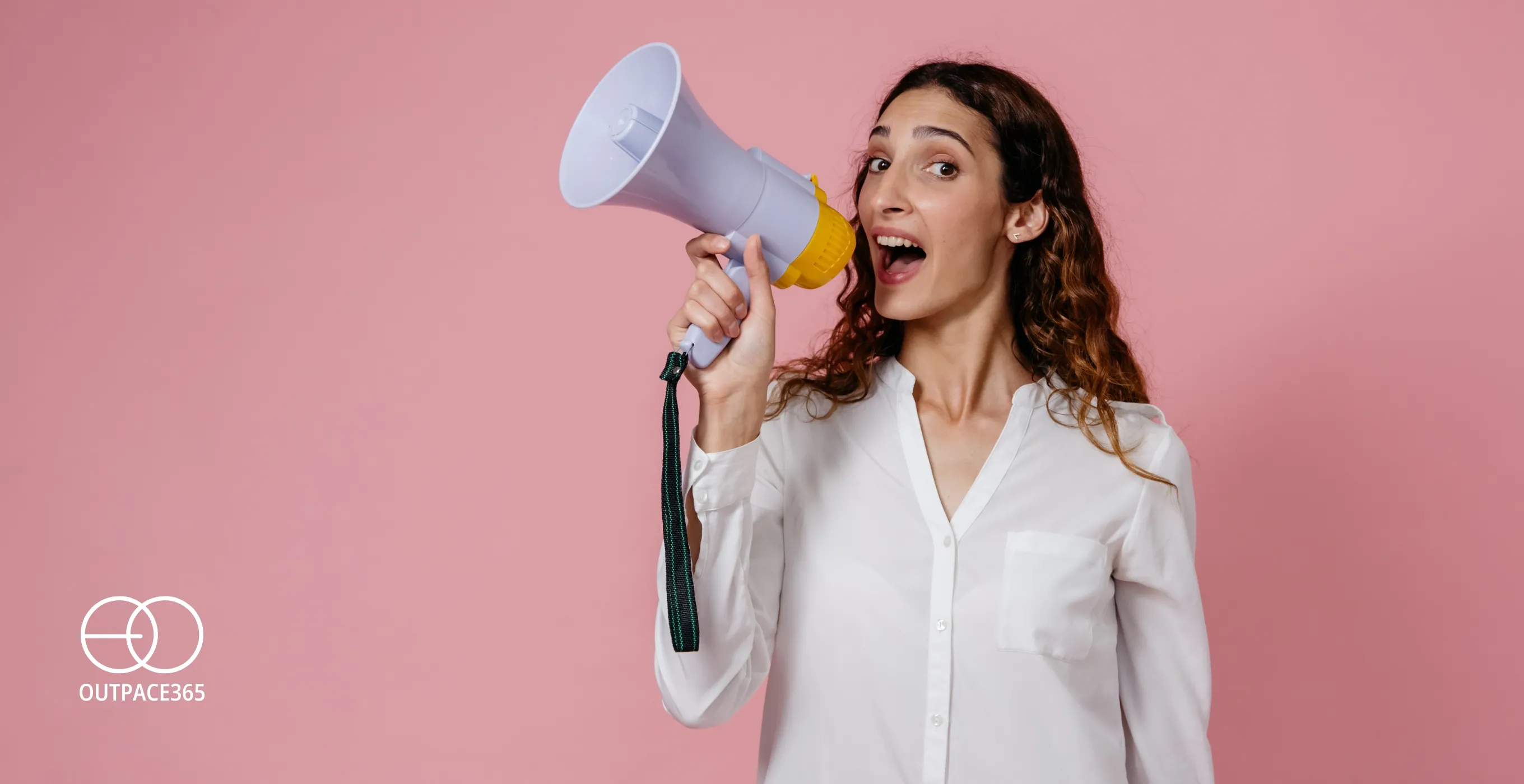 A woman calling out through a megaphone against a pink background