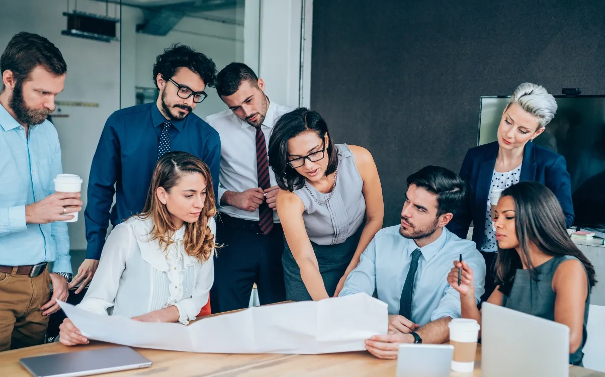 Outpace365 strategists reviewing campaign performance together